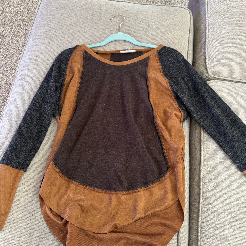 Long sleeve shirt. Cozy and comfortable the brown parts on the shorts are suede.